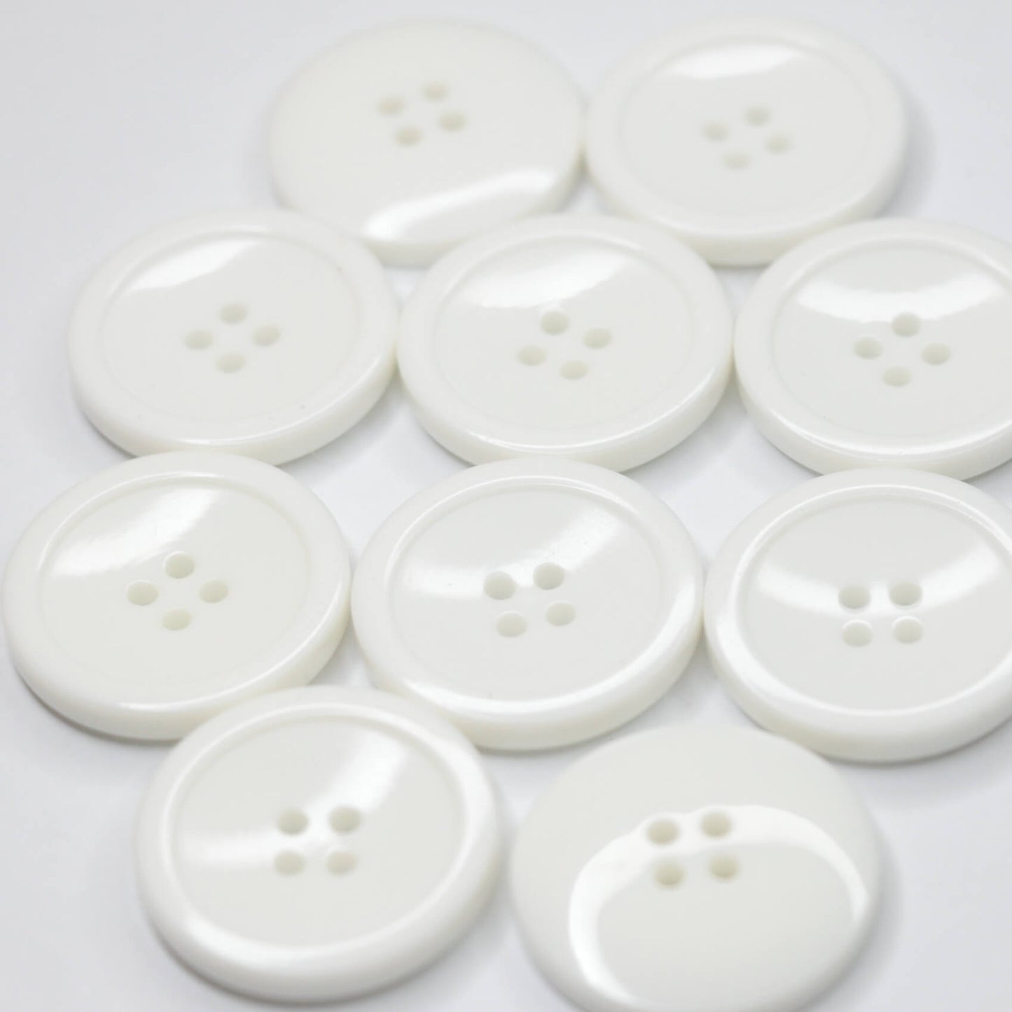 27mm White 4H Plastic Buttons 10pk