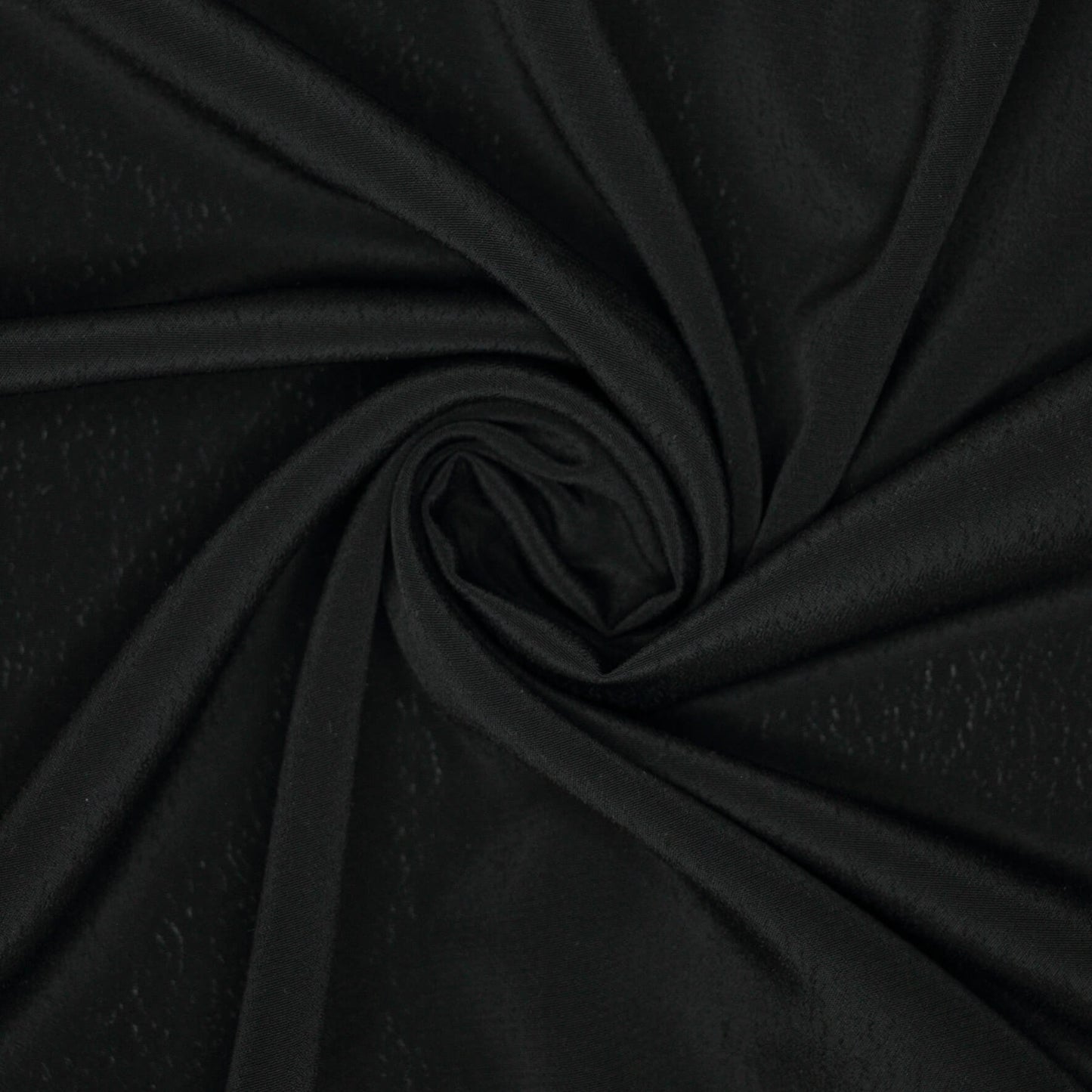Close-up of black fabric with a swirl pattern