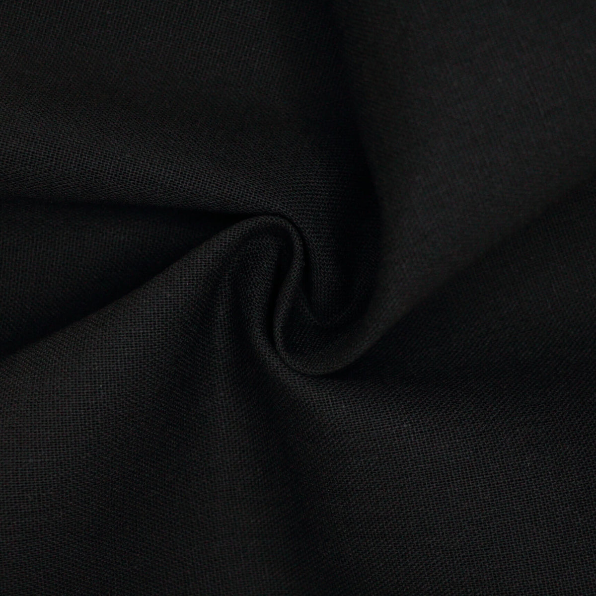 Close-up of black linen mix fabric with folds