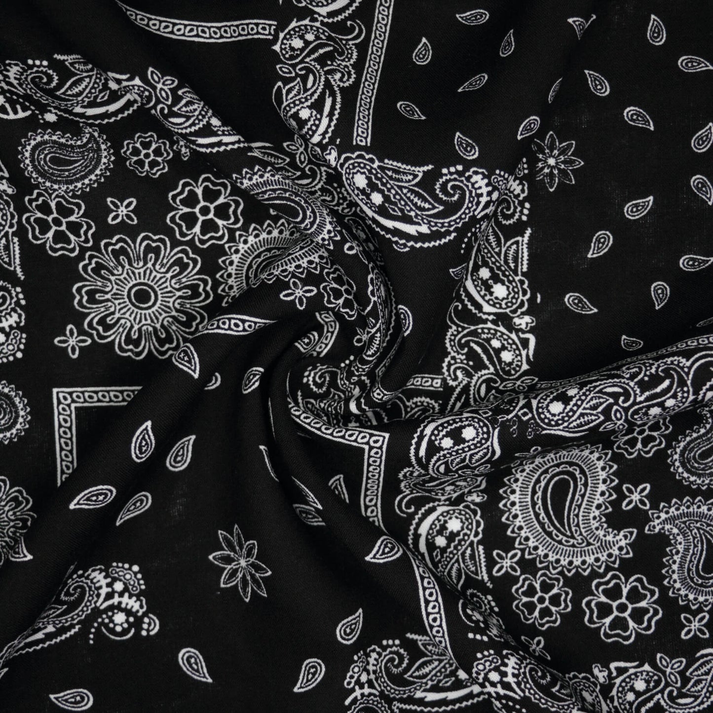 Black fabric with white paisley pattern