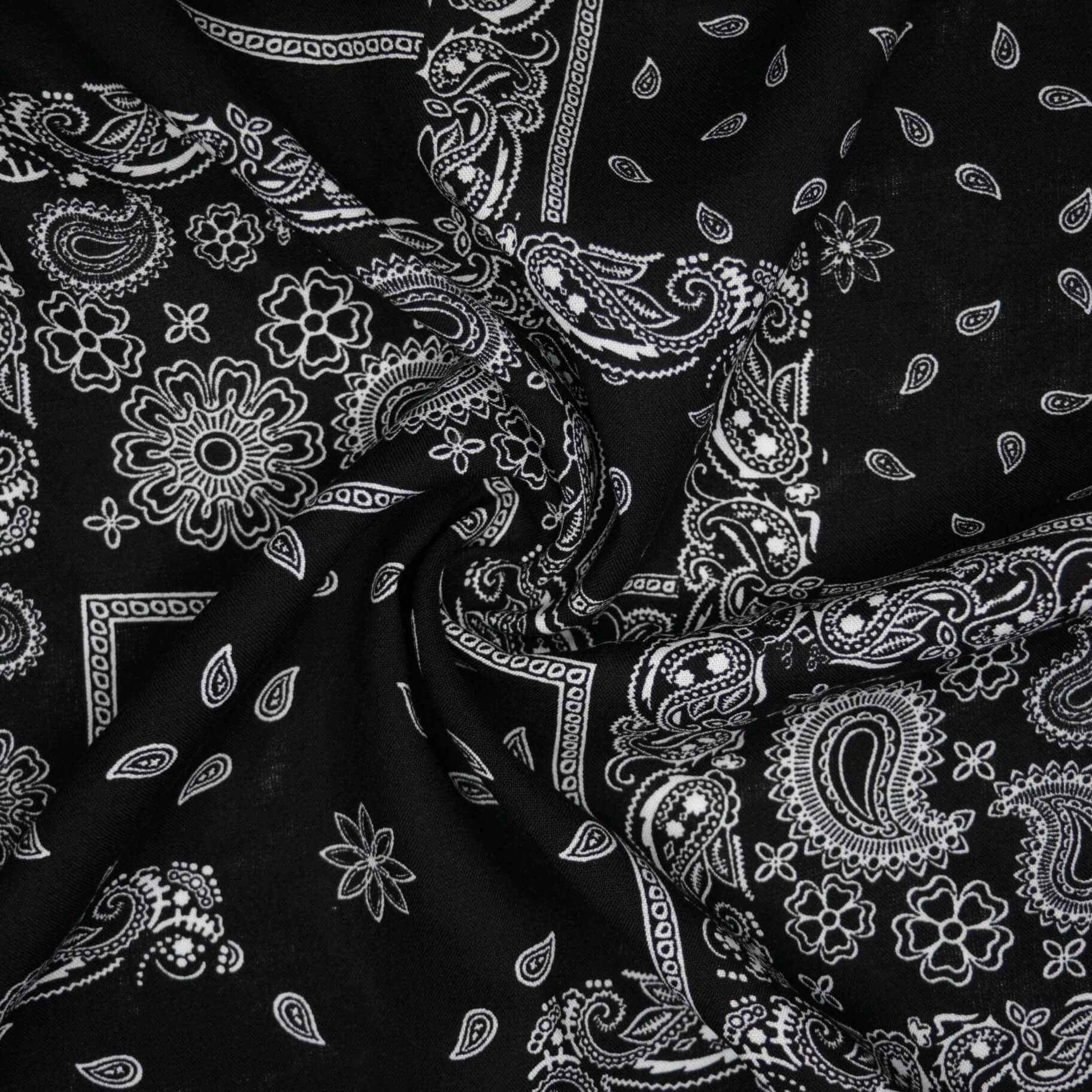 Black fabric with white paisley pattern