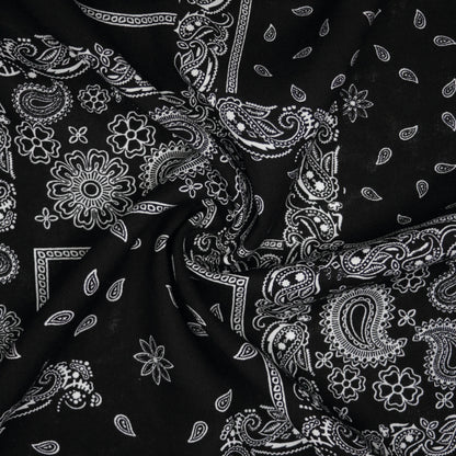 Black fabric with white paisley pattern