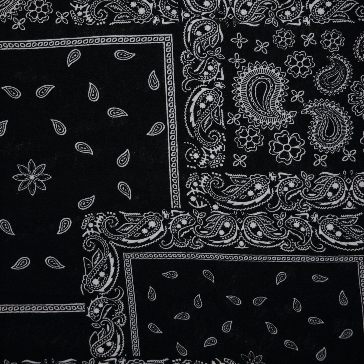 Black bandana with white paisley patterns