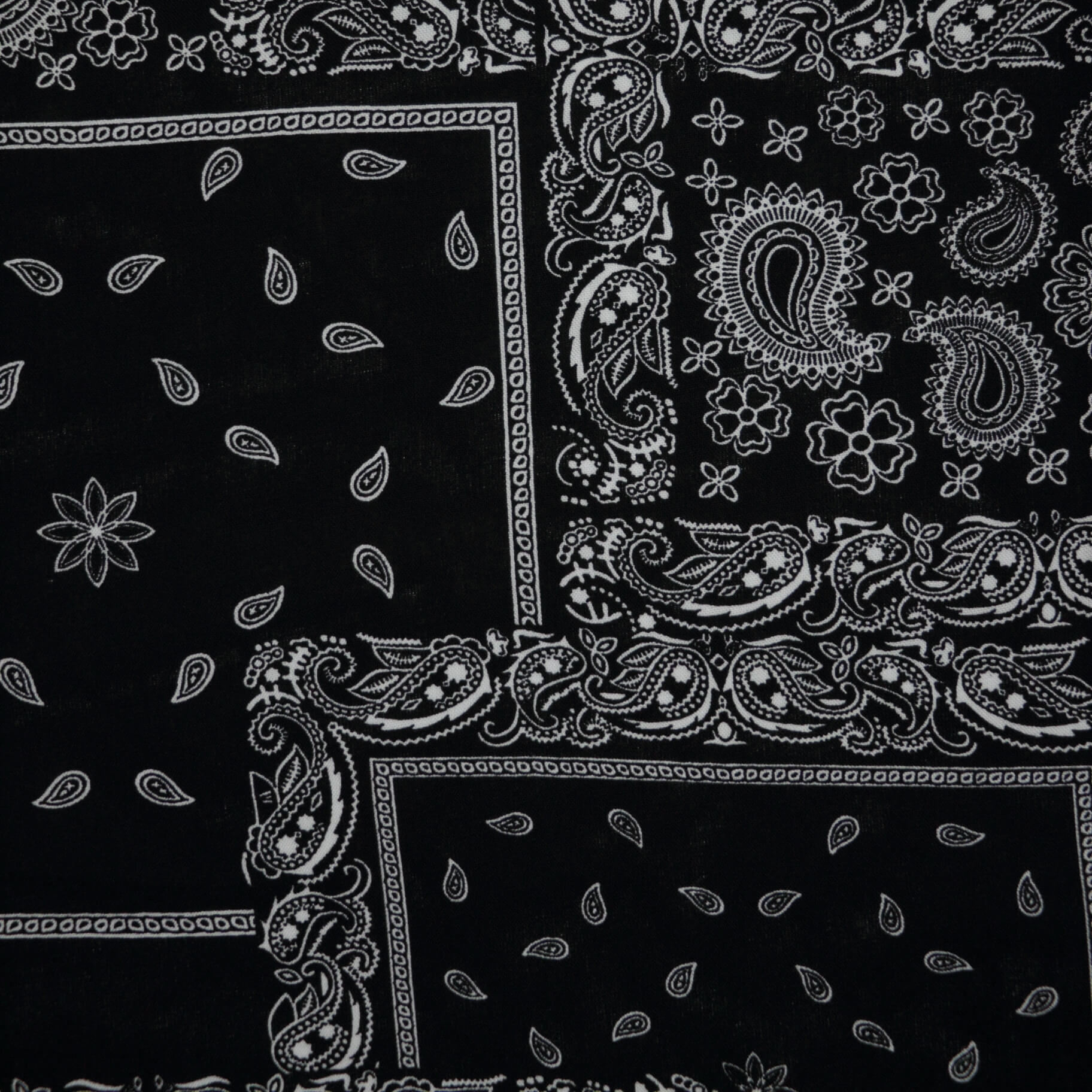 Black bandana with white paisley patterns