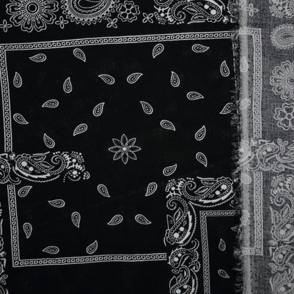 Black fabric with white paisley patterns