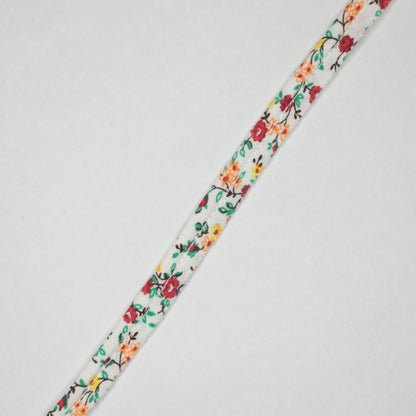 Floral-patterned ribbon on a white background