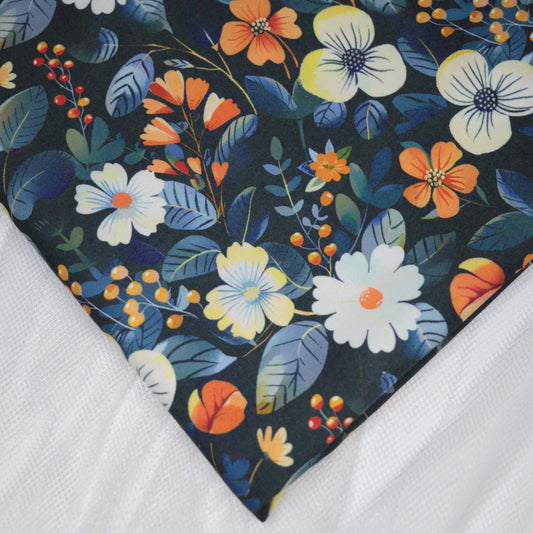 Floral patterned fabric with colorful flowers and leaves on a dark background