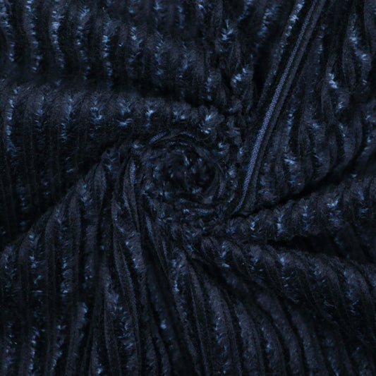 Close-up of dark blue jumbo corduroy fabric.