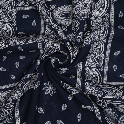 Navy blue fabric with white paisley patterns