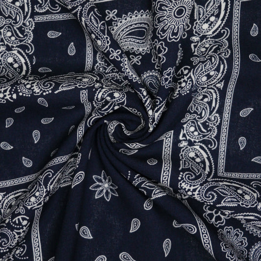 Navy blue fabric with white paisley patterns