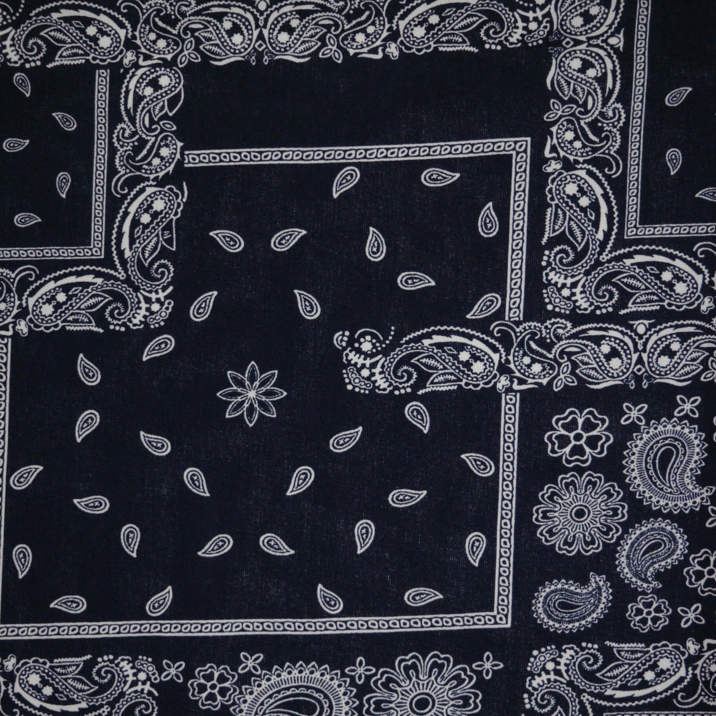 Black bandana with white paisley patterns
