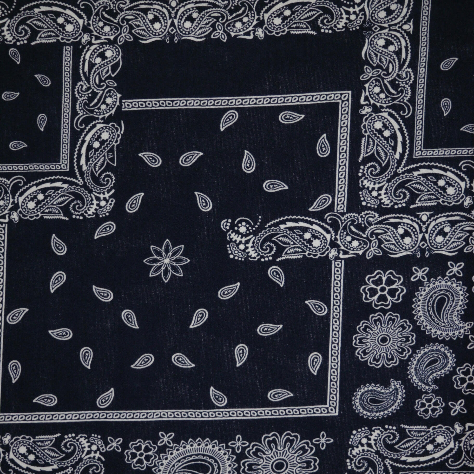 Black bandana with white paisley patterns