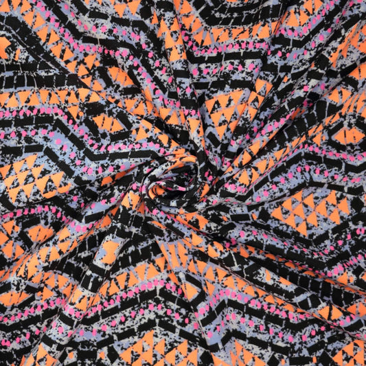 Colorful abstract pattern with orange, black, and pink colors.