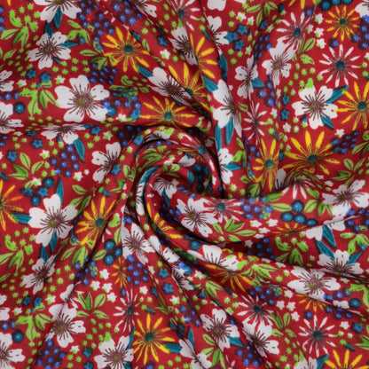 Colorful floral fabric with a red background