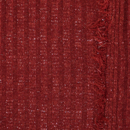 Close-up of red textured fabric with a frayed edge