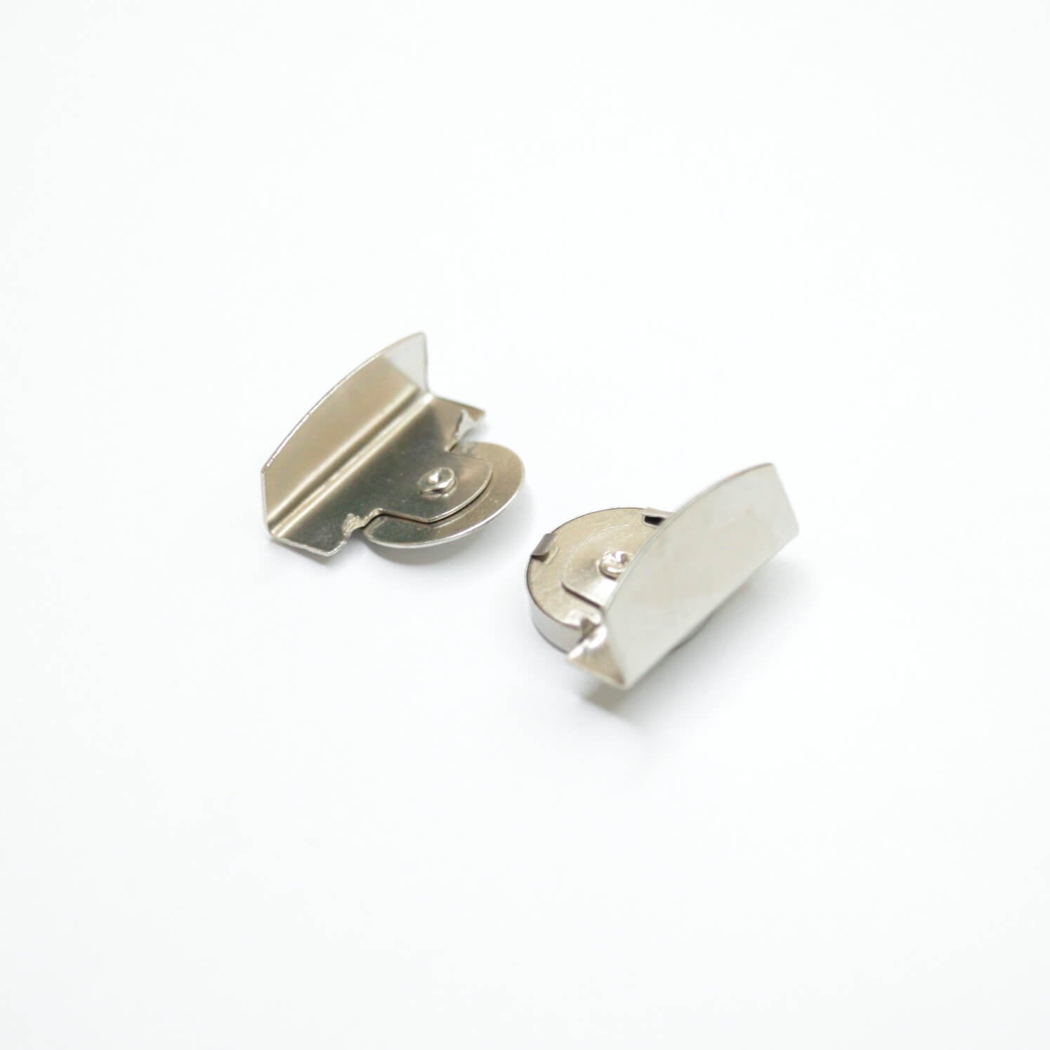 Two small silver metal hardware pieces, photographed on a clean white background.