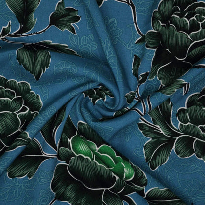 Floral fabric with green leaves on a blue background