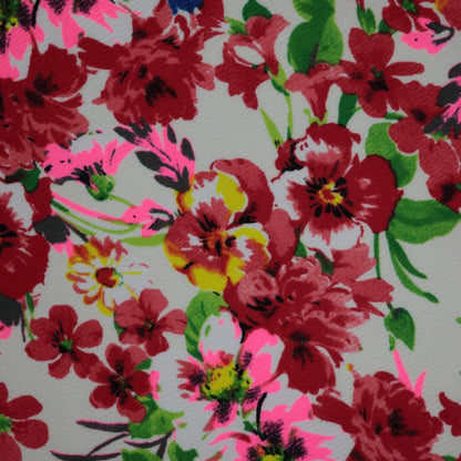 Floral pattern with red, pink, and green flowers on a light background